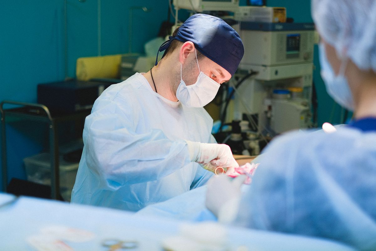 Surgical team performing a procedure in the operating theatre